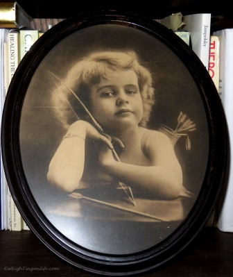antique photo of cupid with arrows